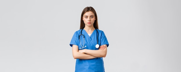 Medical workers healthcare covid and vaccination concept serious and determined professional female