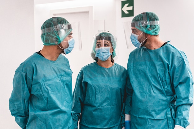 Medical workers inside hospital corridor during coronavirus pandemic outbreak