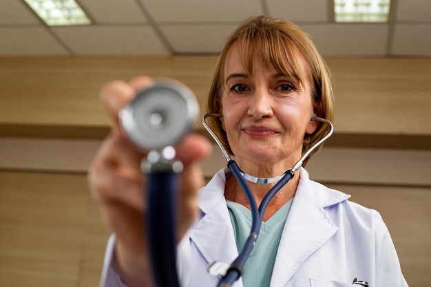 Medicare doctor holding stethoscope for support patient person\
in hospital