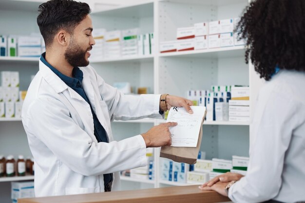 Photo medication prescription and explaining with a pharmacist man talking to a woman customer for healthcare medicine consulting and insurance with a male health professional working in a pharmacy