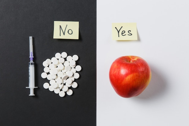 Medication round tablets arranged abstract on white black background