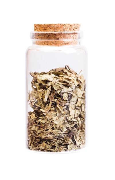 Medicinal herb in a bottle with cork stopper for medical use