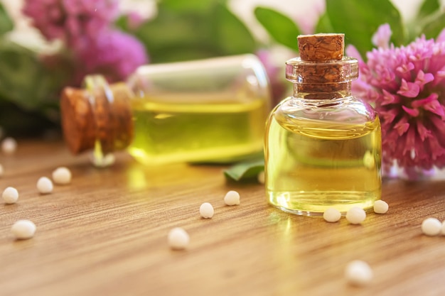 Medicinal herbs, oils in small bottles homeopathy. selective focus.nature