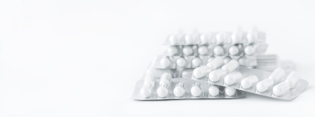 Medicine background - white pills on white background