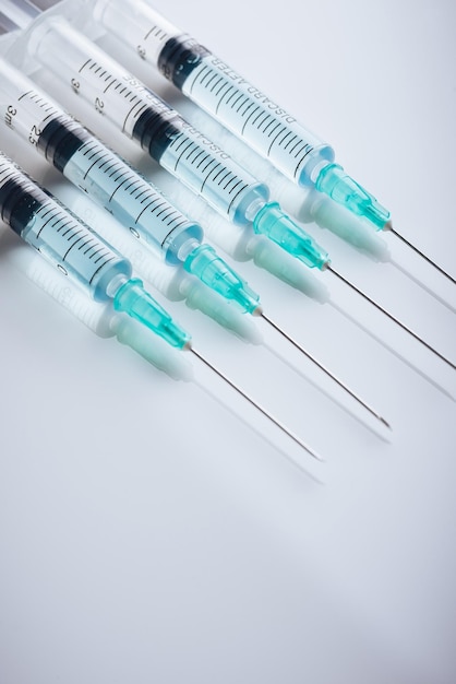 Medicine A bunch of different syringes over a white background