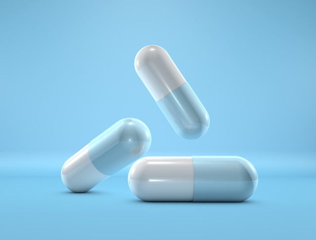 Medicine capsules on blue background