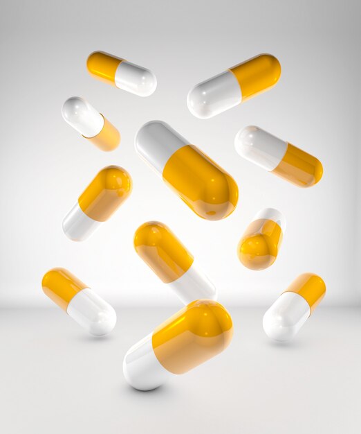 Medicine capsules on white wall