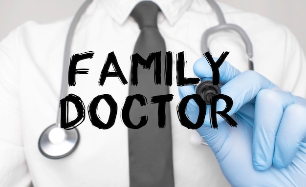 Medicine concept. Doctor writes the word Family Doctor