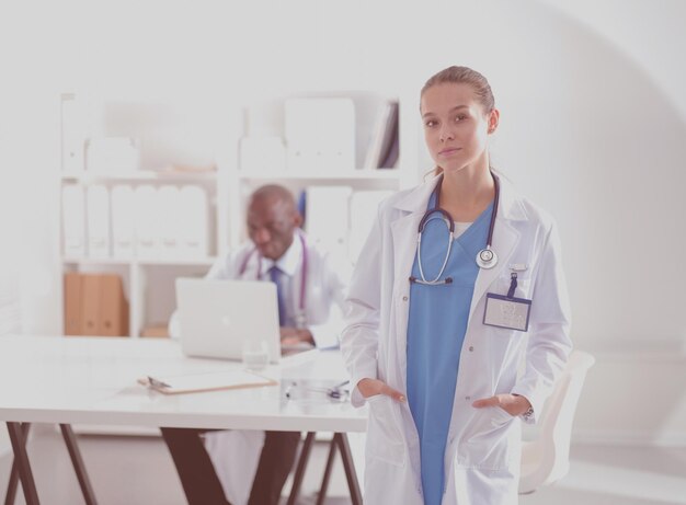 Medicine doctor offering hand to shake in office closeup Doctors