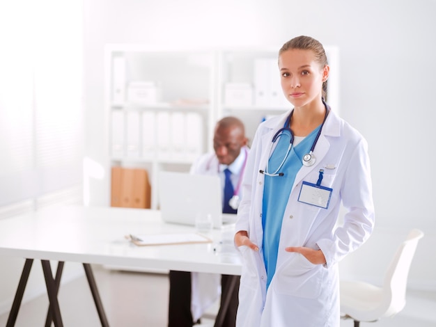 Medicine doctor offering hand to shake in office closeup Doctors