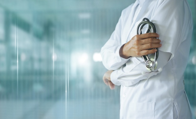 Medicine doctor with stethoscope in hand on hospital,  Medical technology.