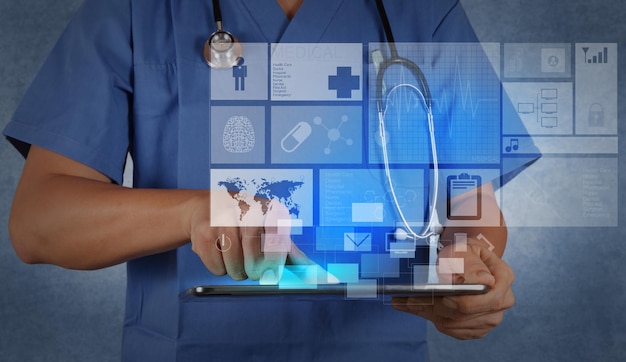 Medicine doctor working with modern tablet computer and virtual interface