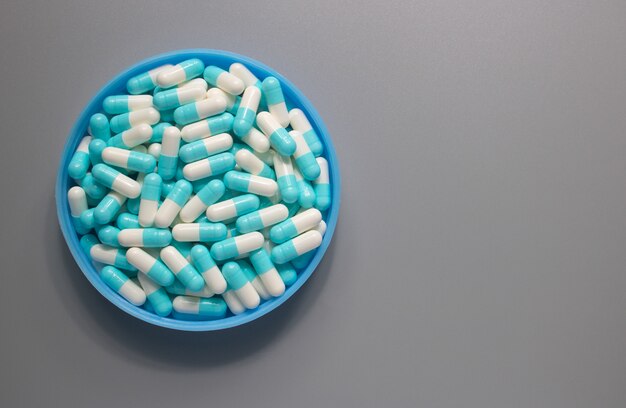 Medicine drug capsule white and blue