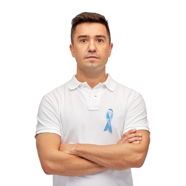 medicine, health care, gesture and people concept - middle aged latin man in t-shirt with blue prostate cancer awareness ribbon pointing finger on himself