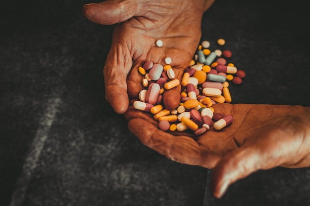 Photo the medicine is in the hands of an old grandmother