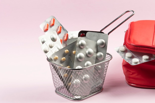 Photo medicine and pill blisters concept in a basket to shop