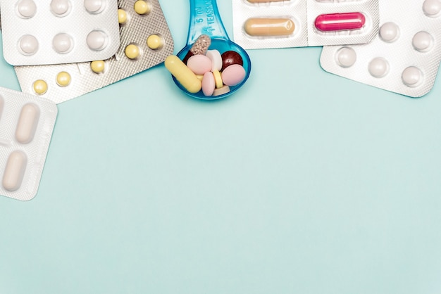 Medicine Pills on on blue backdrop.