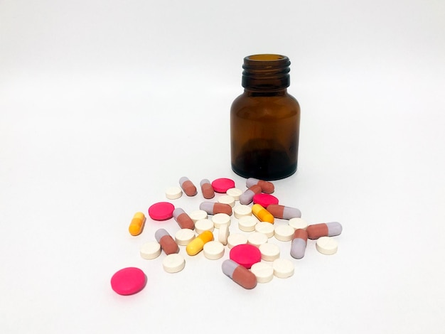 Medicine Pills or Tablets Drop and Out of the Brown Glass Bottle.