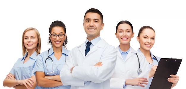 medicine, profession, teamwork and healthcare concept - international group of smiling medics or doctors with clipboard and stethoscopes