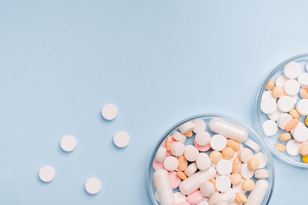 Medicine researching pharmaceutical background Many different drugs pills and tablets in a glass laboratory jar