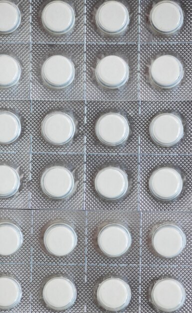 Medicine shipping pills in a package on a yellow background with copy space