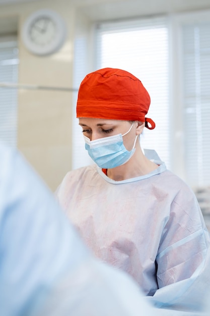 Medicine worker in uniform and mask Handsome doctor surgeon specialist Stock photo