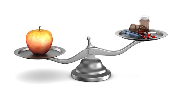 Medicines and apple on scales