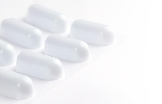 medicines, white pill on a light background, pill