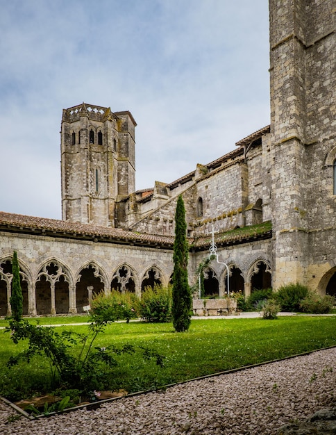 The medieval cloister and tower of the Saint Pierre collegial church in La Romieu, south of France