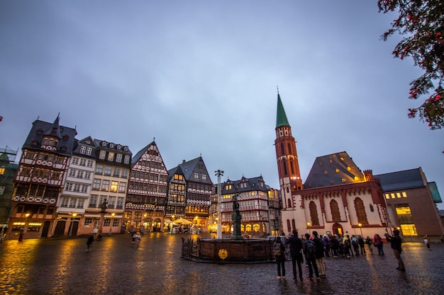 Medieval historical buildings at old town square with Justitia statue in Frankfurt, Germany.