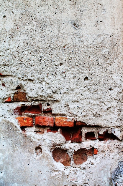 Medieval old house Fragment texture of brick plastered old masonry