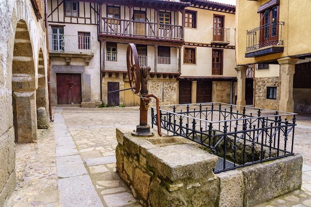 Medieval old town square with fountain and water well sequeros salamanca