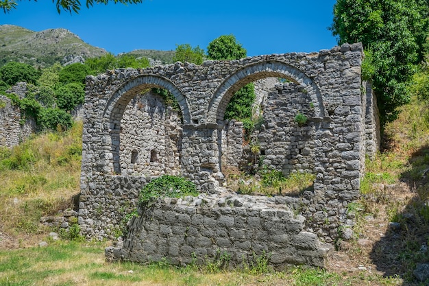 Medieval stone fortress is located high in the mountains.