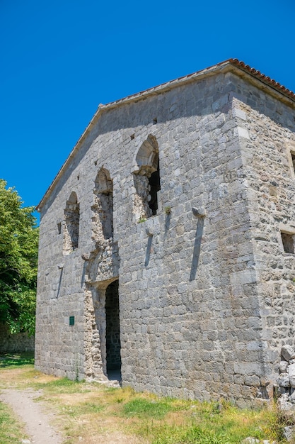 Medieval stone fortress is located high in the mountains