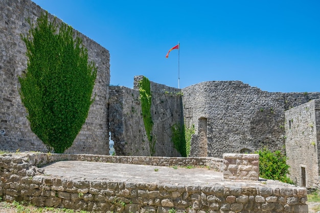 Medieval stone fortress is located high in the mountains