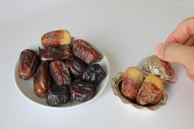 Medina date varieties in a copper pot. ramadan themed photo