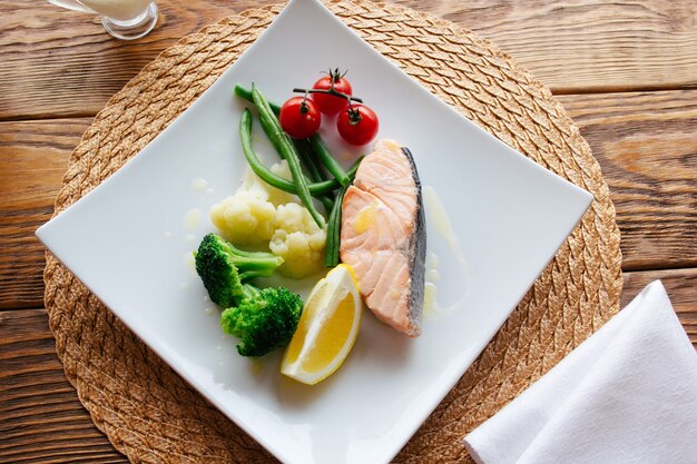 Mediterranean cuisine. Salmon steak with vegetables.