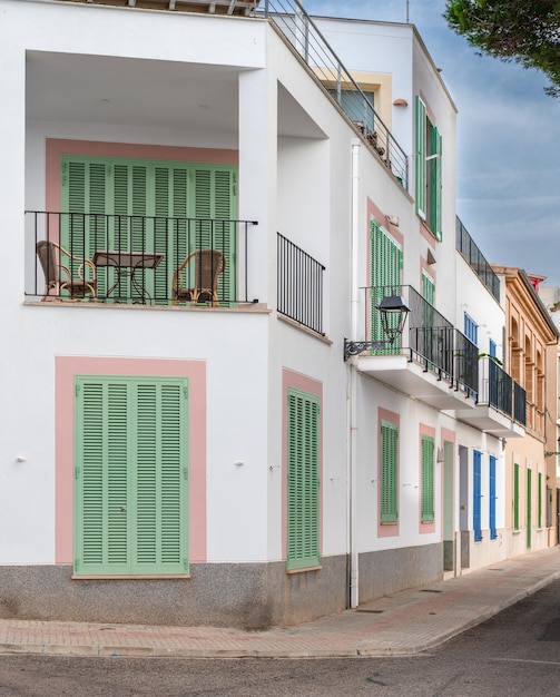 Mediterranean houses lined up seen from a corner of a street