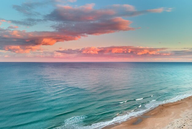 The Mediterranean Sea under a colorful sky in La Mata, Torrevieja, Costa Blanca, Spain during sunset