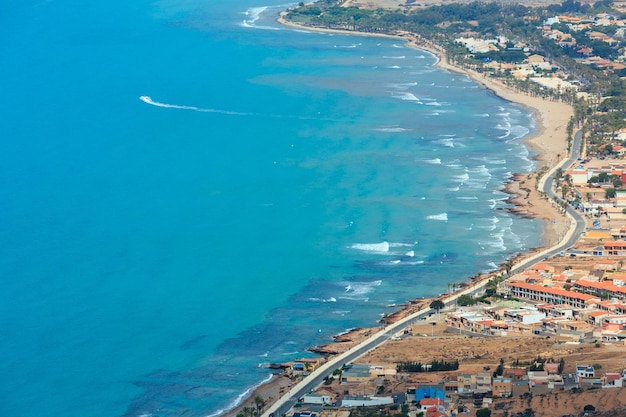 Mediterranean Sea summer coastline. Top view from Tinoso cape (Cartagena, Spain). All people are unrecognizable.