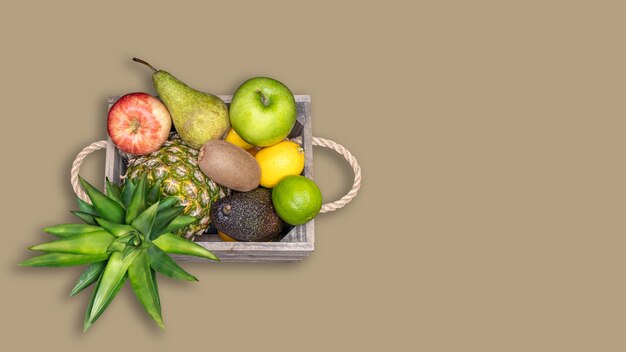 Mediterranean and tropical fruit in wooden box. Antioxidant diet concept