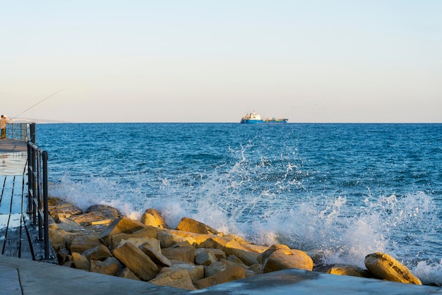 Mediterranean waves beat the shore near the city of Limassol in Cyprus