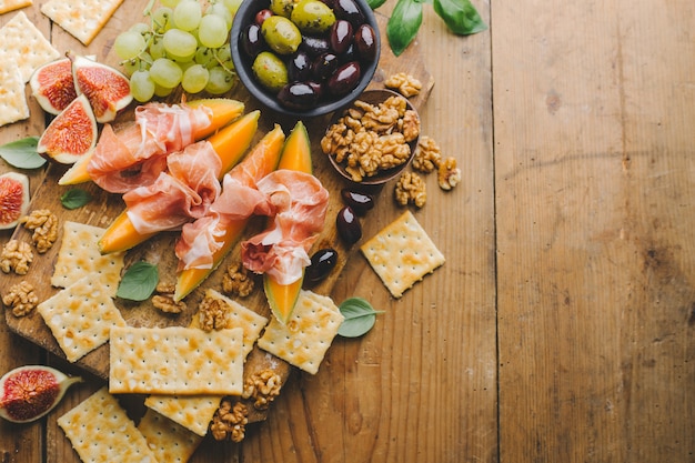 Mediterranian appetizers on old wooden table