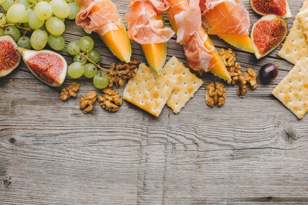 Mediterranian appetizers on old wooden table