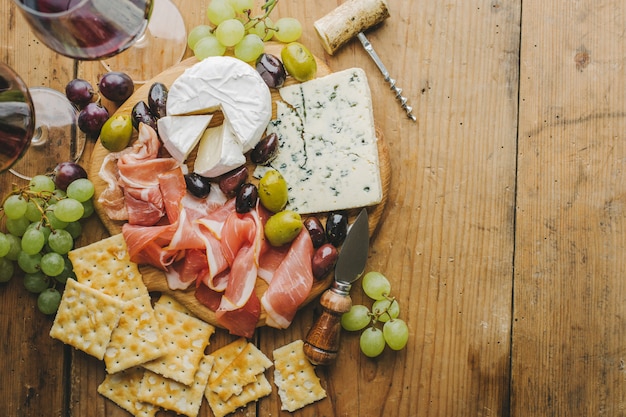 Mediterranian appetizers on old wooden table