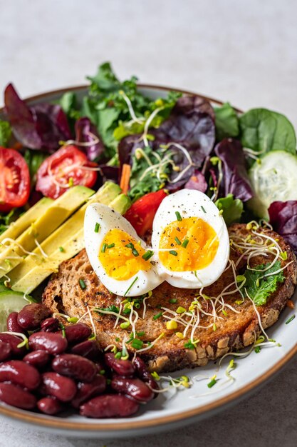 Medium boiled eggs with sasld healthy breakfast