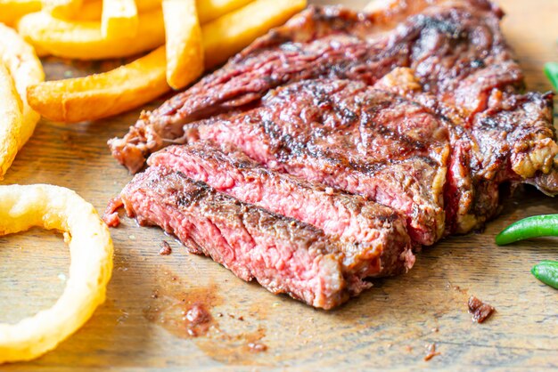 medium rare beef steak with vegetable and french fries