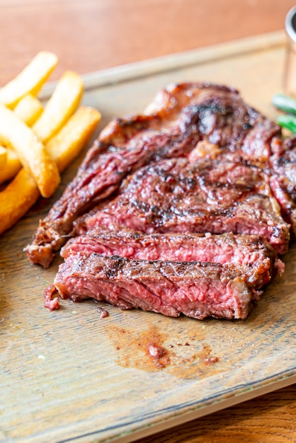 medium rare beef steak with vegetable and french fries