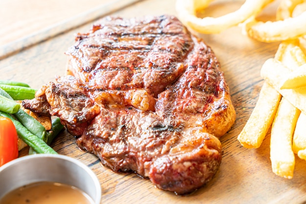 medium rare beef steak with vegetable and french fries