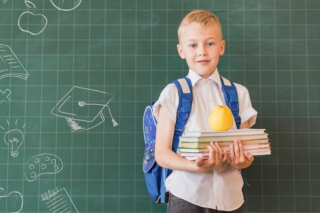 Medium shot boy portrait with graduation background